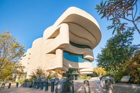 Washington DC USA - October 27 2014; Low point of view image of Douglas Cardinal designed National Musuem of the American Indian and stunning architectural example.のeditorial素材