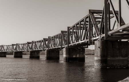 Old-fashioned steel truss railway bridge across Tauranga harbour,  New Zealand.