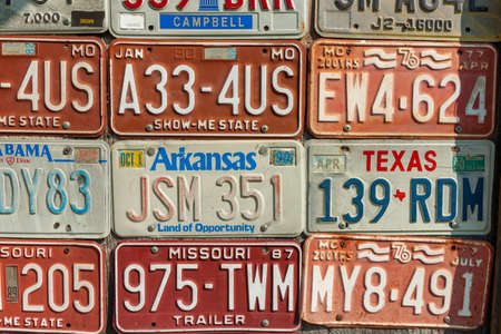 Carthage USA - September 7 2015; Editorial collection old vehicle number plates on wall recording old unique registration numbers.のeditorial素材