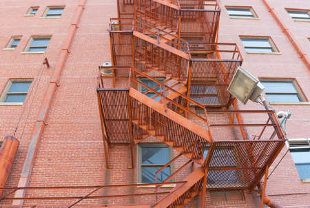 Old style exterior fire escape stairs on buidling in Tulsa, Oklahoma 1USA.のeditorial素材