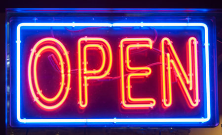 Open sign, illuminated in blue and red neon lighting