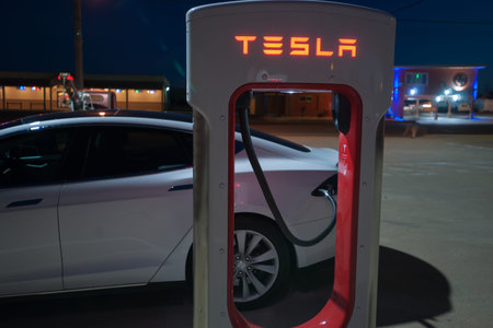 Shamrock USA - September 11 2015; Tesla electric vehicle recharge station with electic vehicle