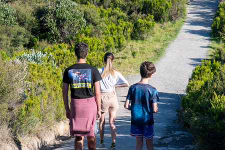 Mount Maunganui New Zealand - December 15 2020; Three siblings walking on summit Mount Maunganui early mon1ringのeditorial素材