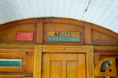Queenstown New Zealand - February 28 2015; Old-world transportation images of close-up signs or components in interior of First Class carriage in vintage steam engine trainのeditorial素材