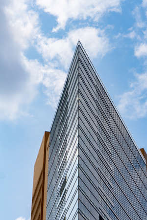 Berlin, Germany - September 25, 2017: Acute angle on exterior of building glass curtain facade.のeditorial素材