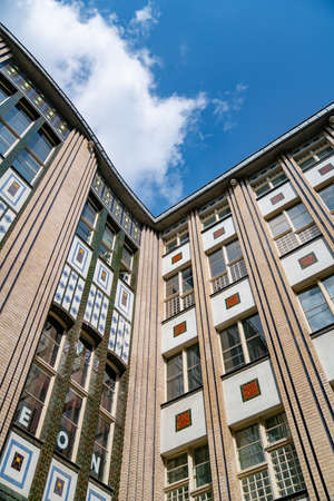 Building corner detail from low point of view against blue sky.のeditorial素材