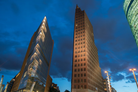 Berlin, Germany - August 28 2017;Three modern architectural styles and shapes high-rise commercial buildings Bahn Tower glass curtain and Kollhof Tower brick and triangular Renzo Piano exteriors of skyscrapers on the Potsdamer Platz in Berlin, Germanyのeditorial素材