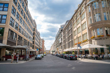 Berlin, Germany - September 25, 2017: Urban street with cafes and bars with outdoor dining under sunshades in afternoon sun.のeditorial素材