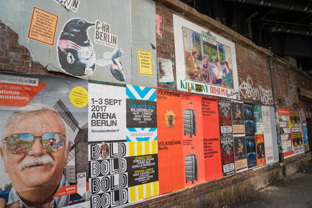 Berlin, Germany - August 27 2017; Wall of bills posted advertizing events, and business in city.のeditorial素材