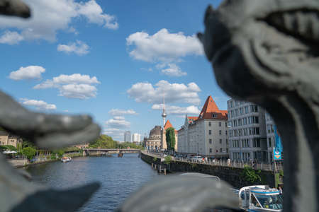 Berlin Germany - August 26 2017; View through decorative railing of Ebert Bridge across River Spree to famous buildings of orange roof of Alexander Kaiser, Bode Museum and Berlin TV towerのeditorial素材