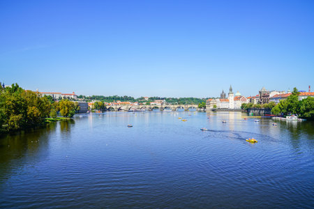 Prague Czech Republic - August 30 2017; Urban river landscape with small craft and people in distance enjoying summer day from Palacky Bridge.のeditorial素材