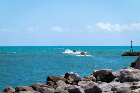 Whakatane New Zealand - January 30 2022; Small boats leaving harbour heading out to sea fishing.のeditorial素材