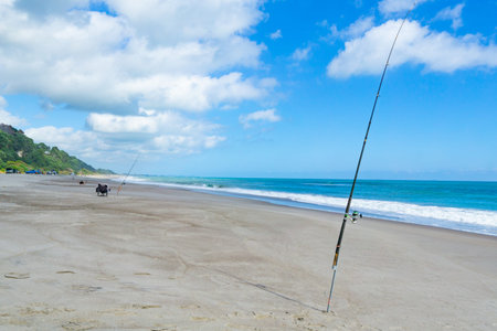 Long sandy beach at Matata in Eastern Bay of Plenty during fishing competition, New Zealand.