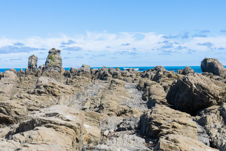 Rugged rocky coastline and view to horizon on east coast of Bay Of Plenty, New Zealand at Te Kaha.