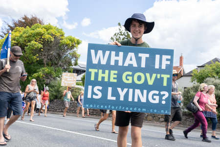Tauranga New Zealand - February 26 2022; Local people taking part in covid pandemic anti-mandate protect march.のeditorial素材