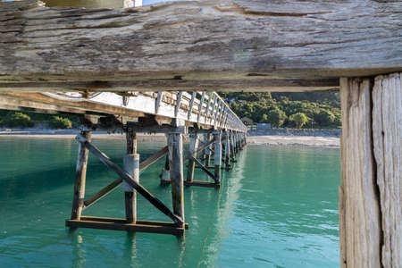 Structure patterns and reflections under historic Jackson Bay pier, South Island New Zealand.のeditorial素材