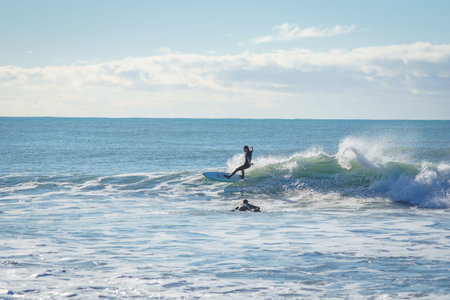 Kaikoura New Zealand - May 11 2022; Stony Mangamaunu, beach near Kaikoura with surf rolling in and...