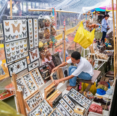Bangkok Thailand - August 10 2007; Vendor in stall of display insects for sale to tourists in floating marketsのeditorial素材