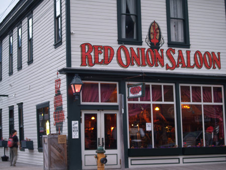 Skagway Alaska USA - August 2 2008;City street with old style building facades and sign for Red...