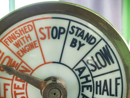 Old-fashioned nautical speed indicator or gauge on-ship, closeup showing some of the terms.