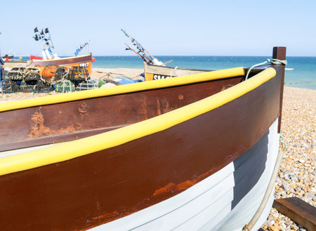 Hove United Kingdom - June 16 2009; Traditional colourful fishing boats of South England pulled up on beachの写真素材