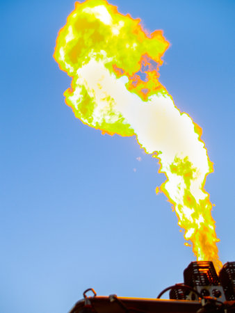 Hot air balloon burner fires up throwing gas flame high into skyの写真素材