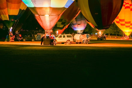 Hamilton New Zealand March 27 2010;  Hot air balloons in bright colours illuminated at nightのeditorial素材