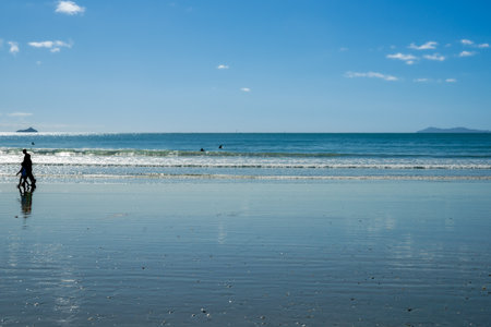 Background image summer beach blue sea and view to horizon at Mount Maunganui.の写真素材