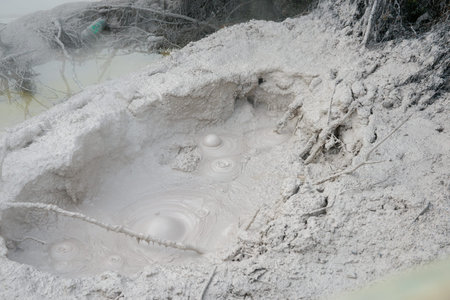 Close up view of a manhole in the ground after a snowfall