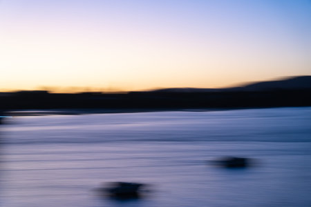 Seascape with boat at sunset. Long exposure motion blur.の写真素材