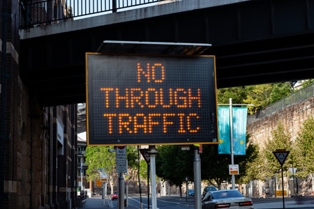Traffic warning sign on city street reading no through traffic.の写真素材