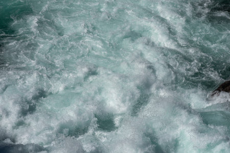 Swirling and surging river water below as the dam gates open at Aratiatia, Taupo New Zealand.