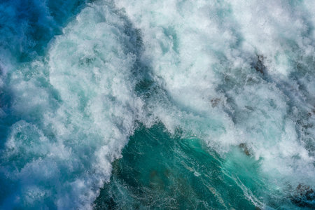 Swirling and surging river water below as the dam gates open at Aratiatia, Taupo New Zealand.