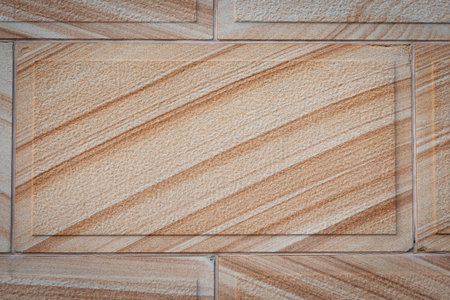 Brown diagonal stripes in stone block wall.