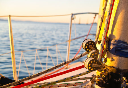Nautical close-up rigging and pulleys at base of mast defocsed background.の写真素材