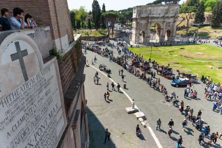 Rome Italy - April 16 2011; Long lines of tourists waiting on cobbled street below Colosseumのeditorial素材