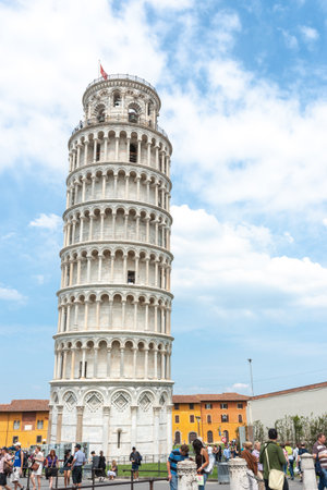 Pisa Italy - April 24 2011; Editorial-Tourists in square around famous Leaning Tower of Pisa in vertical composition.のeditorial素材
