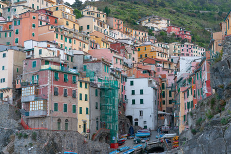 Riomaggiore Italy - April 26 2011; Italian hillside traditional fishing village terrace homes.