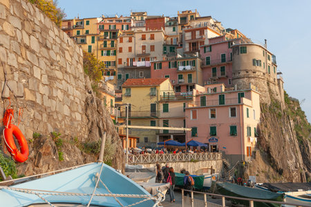 Manarola Italy - April 25 2011; Traditional colourful Mediterranean hillside fishing village terrace homes built on edge of rock cliff in Cinque Terreのeditorial素材