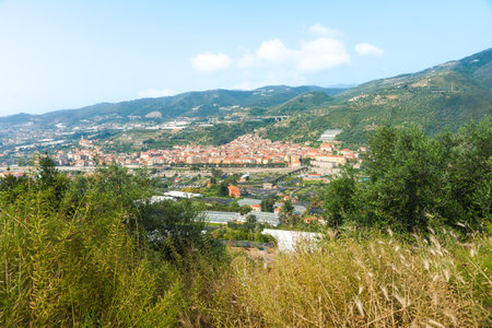 Typical Italian valley village of San Remo, Italy from autostrada.の写真素材