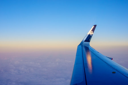 Auckland New Zealand - September 9 2023; Editorial-AirNZ plane wing and wingtip branded logo in flight above cloudsのeditorial素材