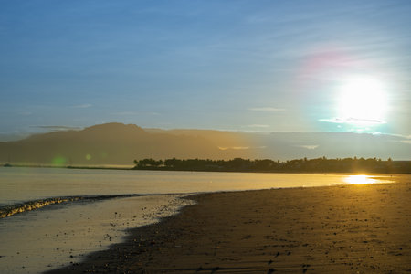 Sunrise over tropical beach at low tide, Denarau, Fiji.の写真素材