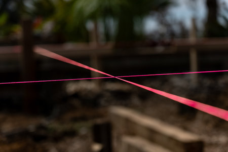 Pink builders string-line closeup on constructions site in selective focus and defocused background.の写真素材
