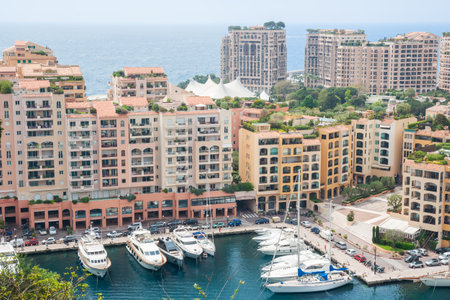 Monte Carlo Monaco - May 2 2011; buildings and boats moored in  marina famous destination of rich and famous, Monaco.のeditorial素材