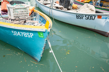 Sermione Italy - May 9 2011; Small boats tied to pier on lake GArda in Italy.のeditorial素材
