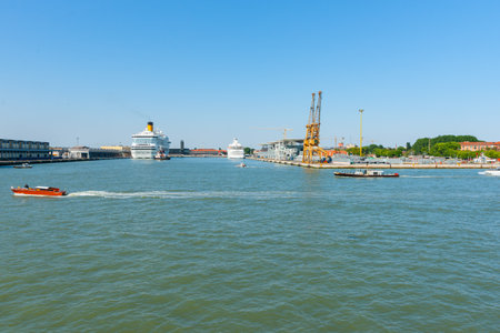 Venice Italy - May 10 2011;Port wharves with industrial cranes and cruise ships berthed.のeditorial素材