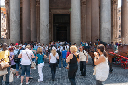 Rome Italy - May 19 2011; Tourists in street crowd around entrance to famous Rome's 2000 year old Pantheon.のeditorial素材