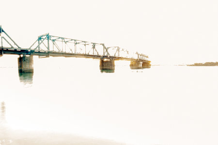 Faded effect of bridge crossing harbour background use image