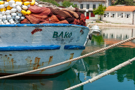 Stari Grad Croatia - May 26 2011;  Stern of fishing boat Bako with nets piled high.のeditorial素材