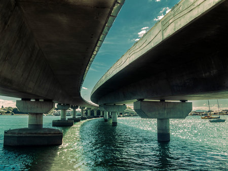Twin bridge structure below and leading lines as it crosses Tauranga Harbour.の写真素材